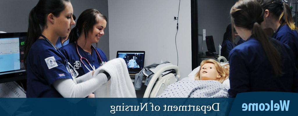 Welcome - Department of Nursing banner - students around a medical mannequin